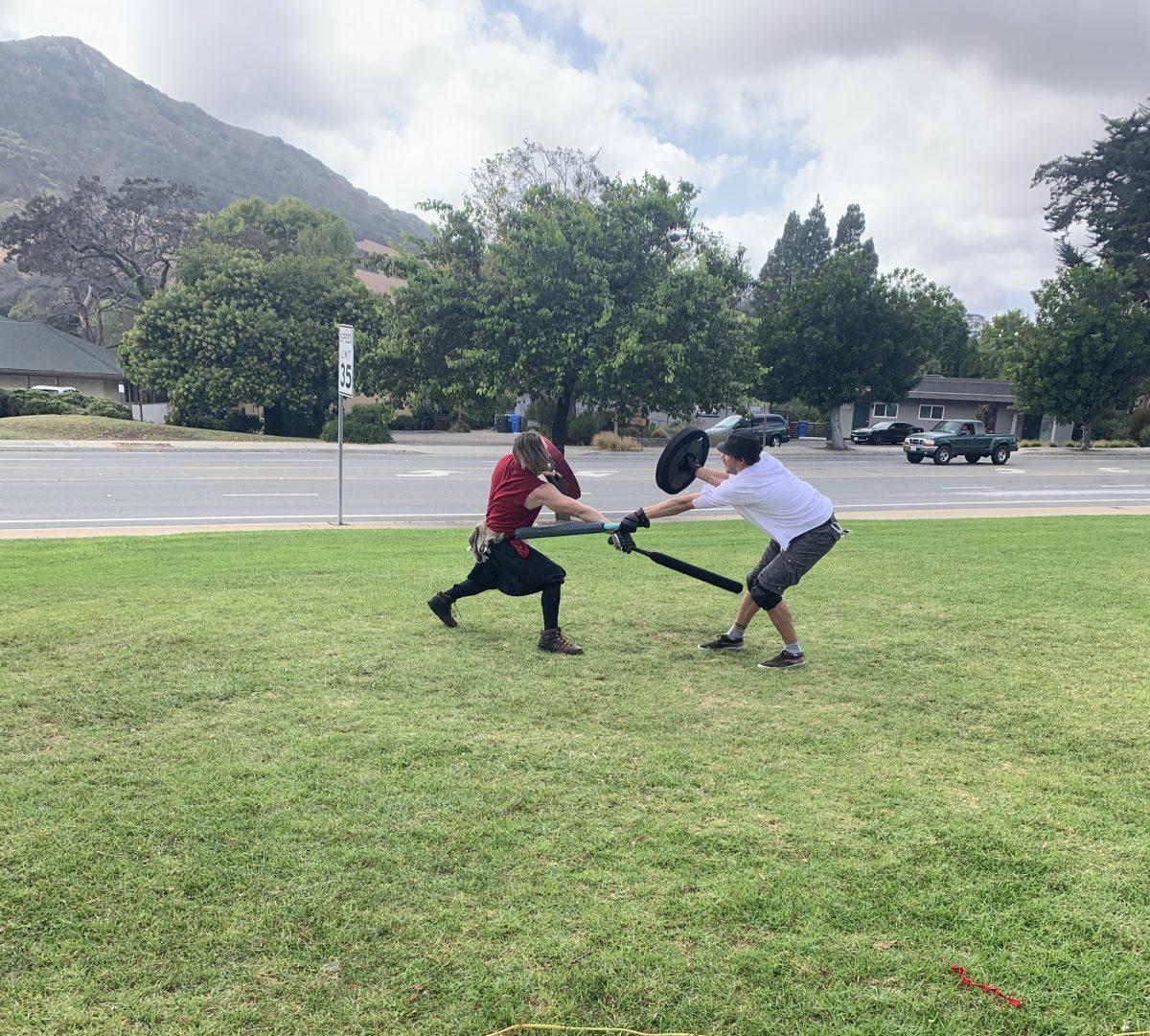 Kenneth Morrison (left) and Jon East (right) sparring before a game of ditch. Photo by Anthony Ramos

