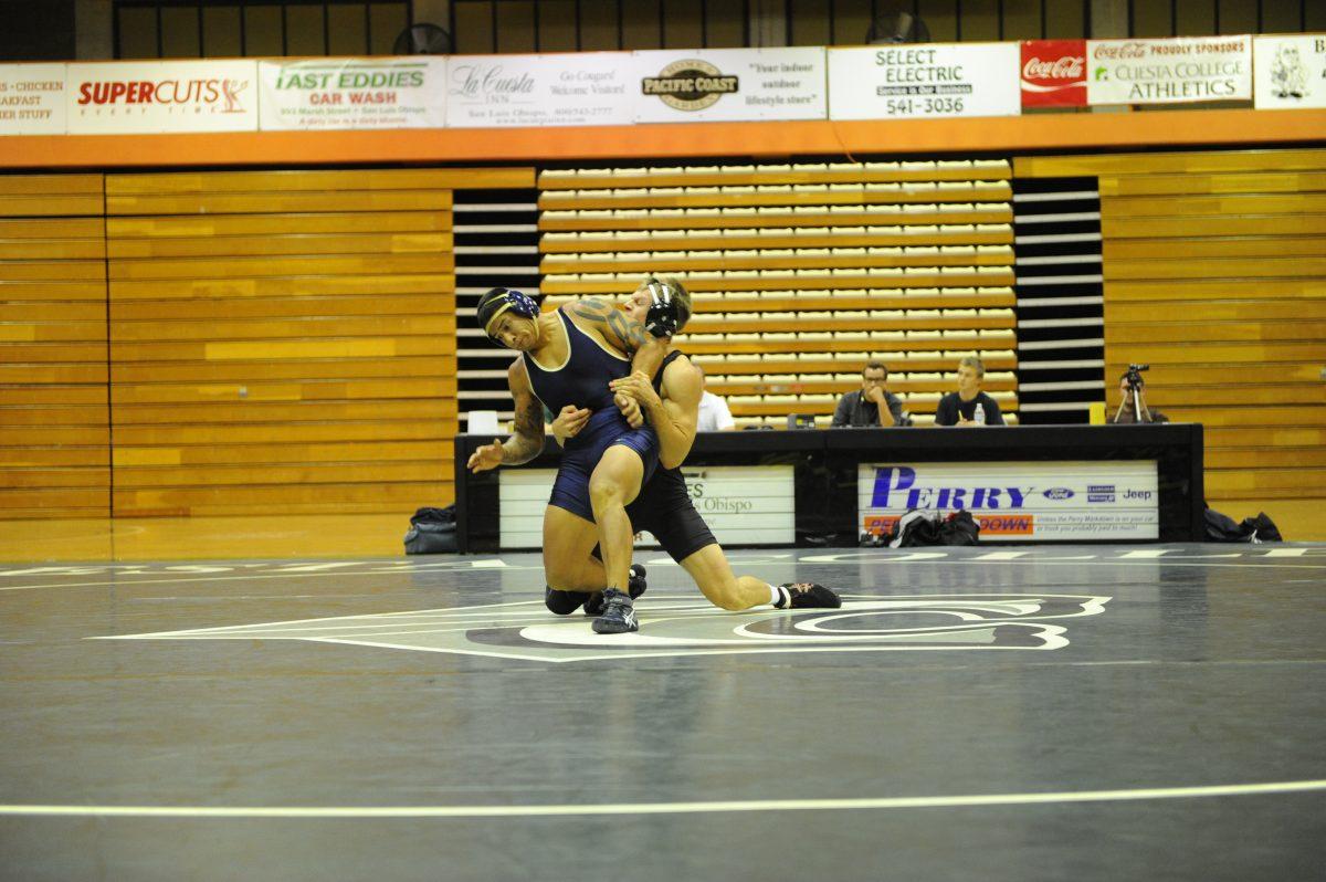 Geoffrey Merker (right) wrestling.