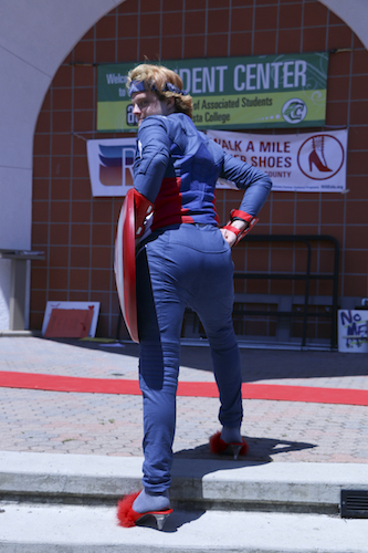 Dressed as Captain America, student Gage Washburn showed the crowd how to properly walk in high heels.
