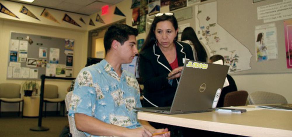 Estella Vazquez, enrollment success specialist, assists Cuesta student in the transfer center.