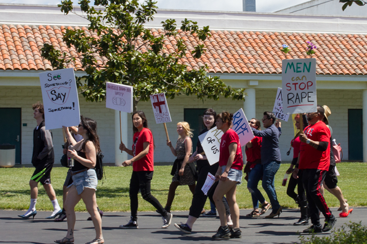 Men and women strut high heels on the one mile march across campus.