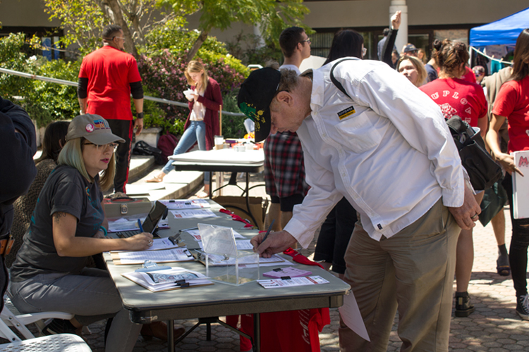 Participants signing-up before the one mile march around the campus.