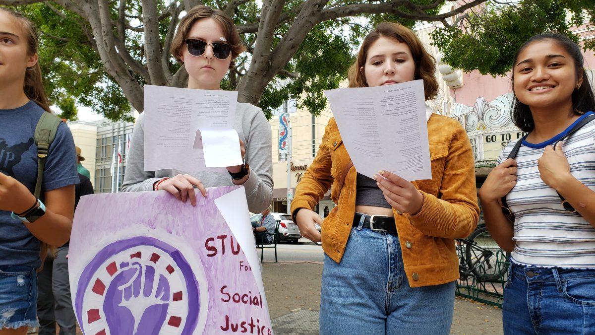 Climate Strike activists sing chants while protesting. Photo by Michael Costa