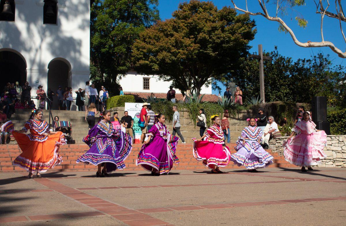 Local high school students dance to folkloric music at the Mission Plaza in San Luis Obispo for a Dia de Los Muertos event. Photo by Guadalupe Angeles