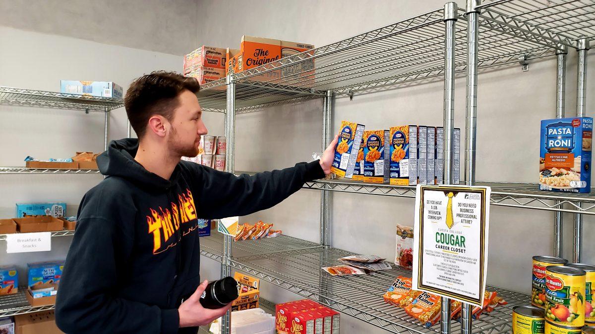 Chace Martin picks up some groceries and a snack at the Cougar Pantry. Photo by Michael Costa