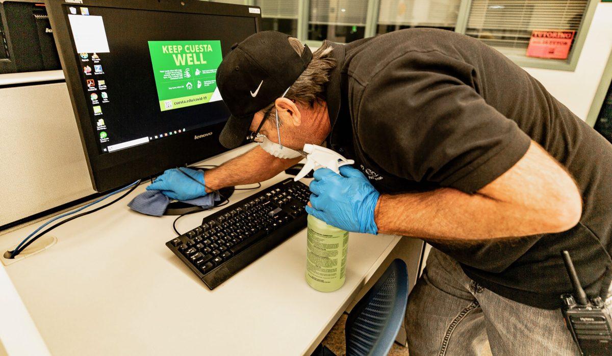 Custodian Jim Rash sanitizes the 3400 lab for COVID-19.  Photo by Michael Costa
