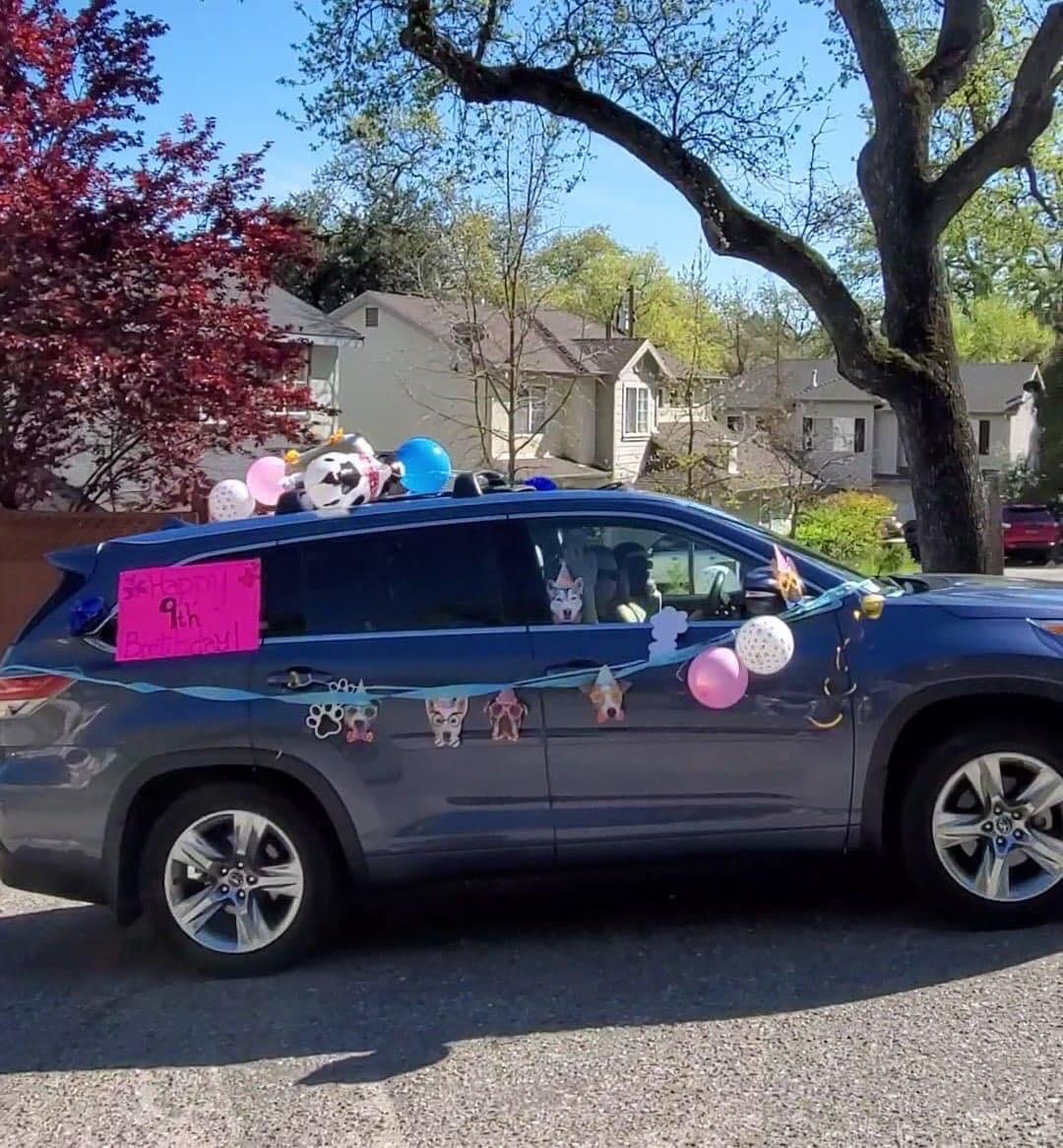 A decorated car drives by for AJâ€™s birthday. Photo by Victoria Acton