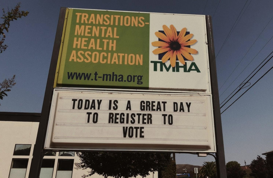 Located outside of Transitions-Mental Health Association in San Luis Obispo is a display sign encouraging people to register to vote. Photo by Peyton Gadbury