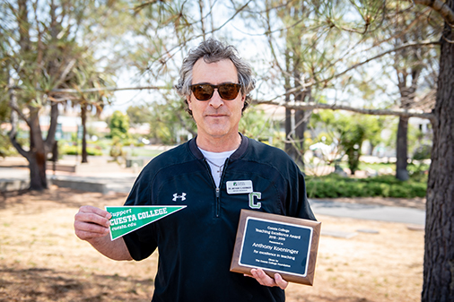 Cuesta College professor Anthony Koeninger, shown holding his 2018 Teaching Excellence awards. Photo by Cuesta College
