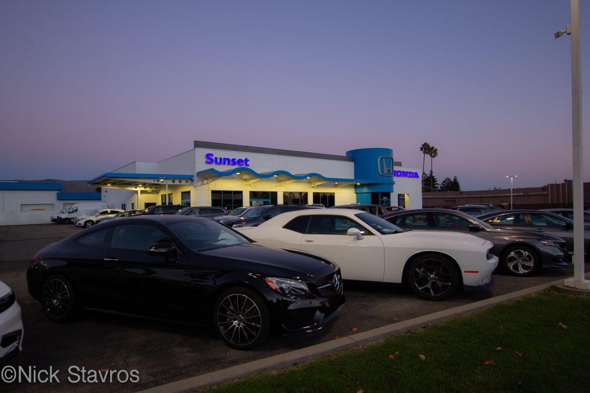 A Mercedes Benz and Dodge Challenger outside Sunset Honda. Photo by Nick Stavros
