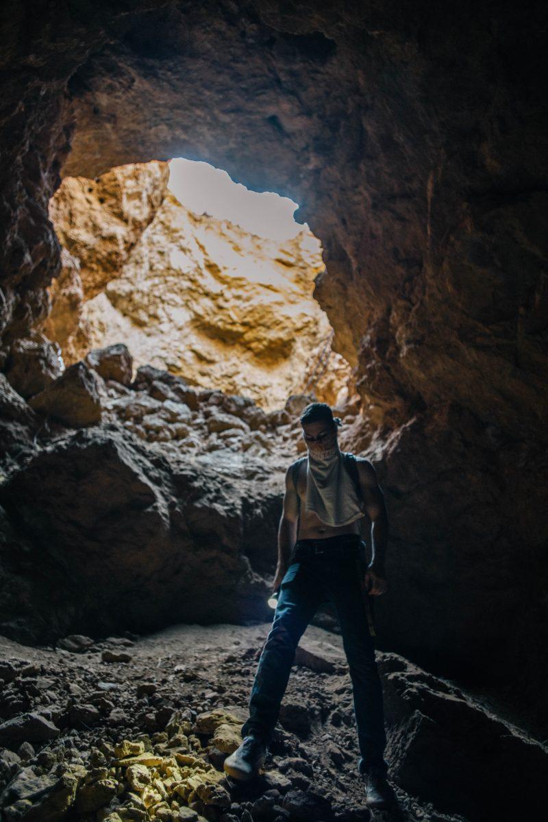 A hiker standing at the bottom of the Rinconada Mine portal. Photo By Dustin Gil