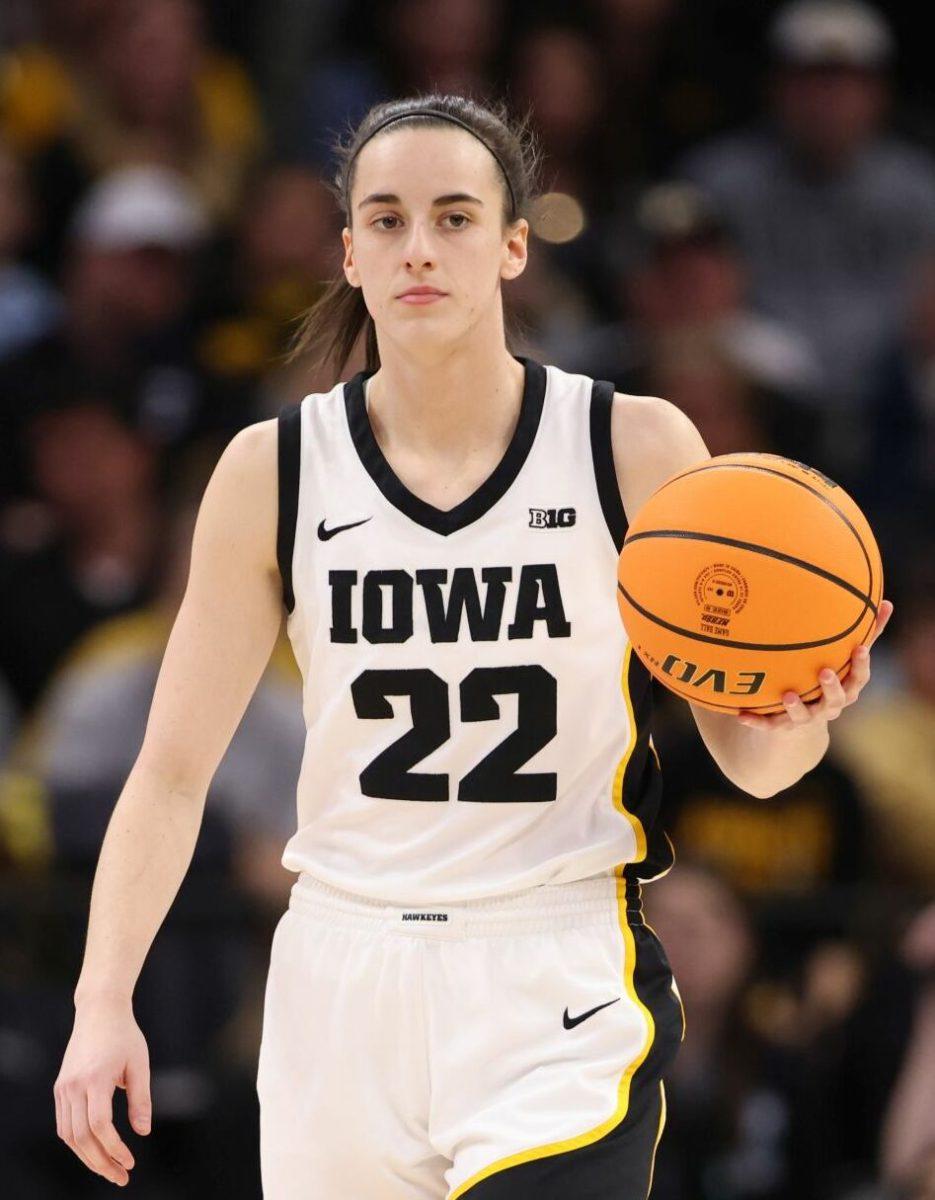 Caitlin Clark in action playing for the Iowa Hawkeyes. Photo by John Mac