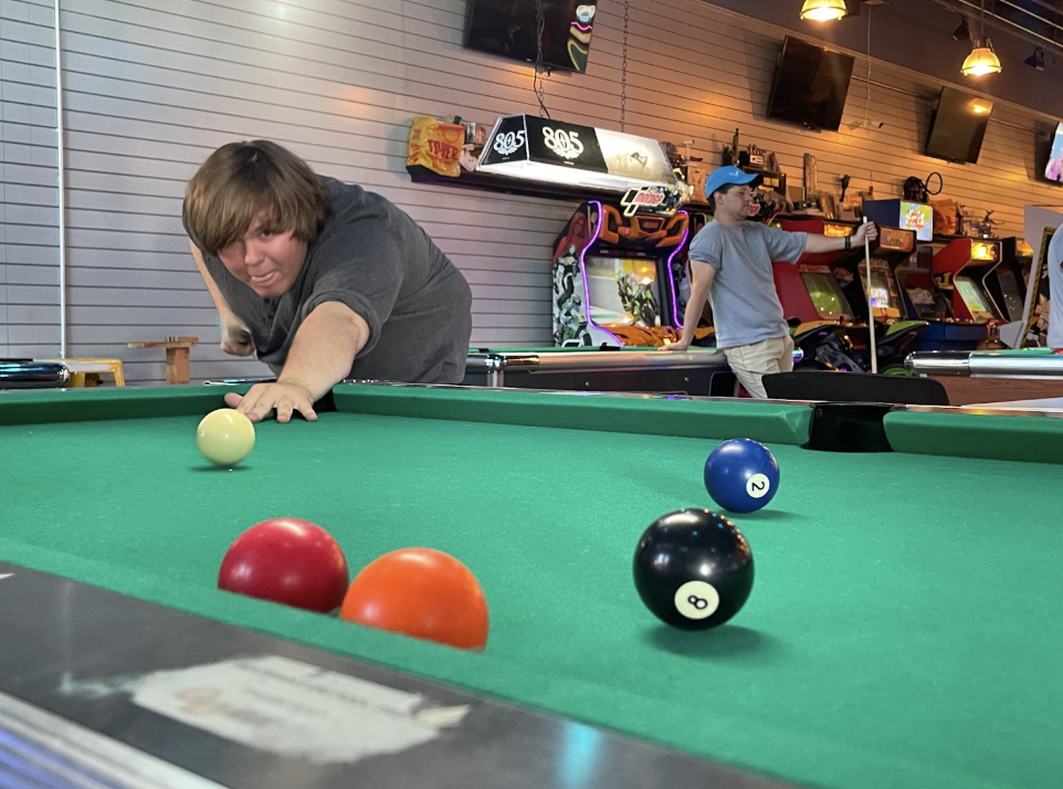 First-year Cuesta College music major, Darian Lamar, shoots pool with his friends at BA Start Competitive Arcade and Taproom on Sunday, September 14. BA Start offers food (including a cotton candy machine), beverages, pool tables, pinball and games galore. They are open Tuesday through Sunday for players of all ages until 8 p.m. but 21+ after that. The games are card-operated and are available at kiosks throughout the space.