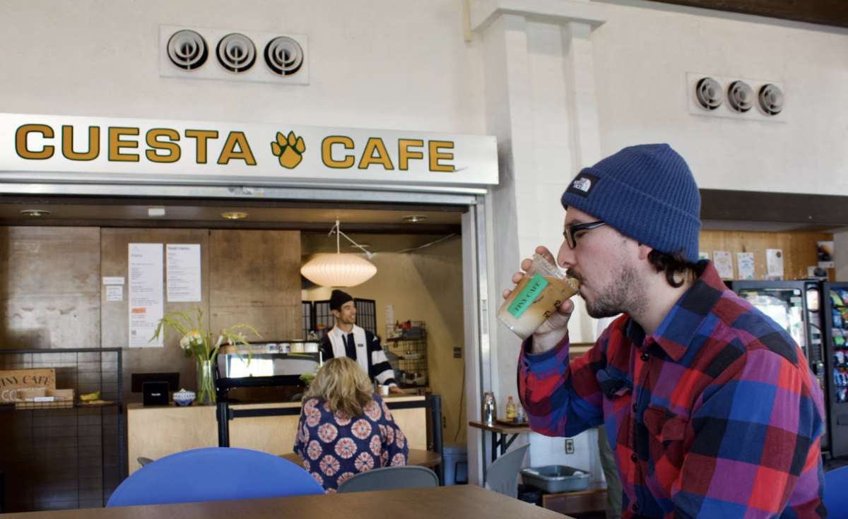 Third-year Cuesta College student Reuben Garcia enjoying his iced latte in the cafeteria. "I knew about Tiny Cafe before they came to Cuesta, and was so happy to have them here," he said.
