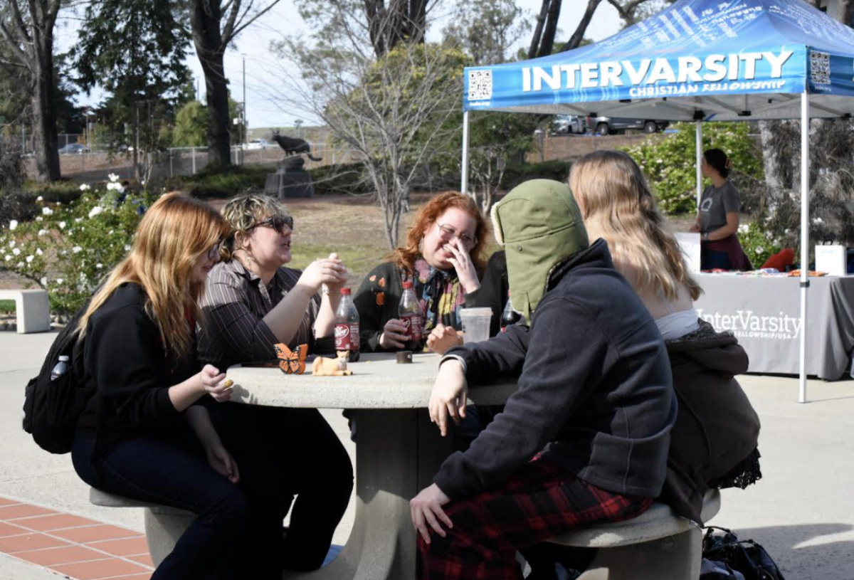 Lots of laughter as friends are reunited on campus at Cuesta College on the first day of the spring 2026 semester. 

