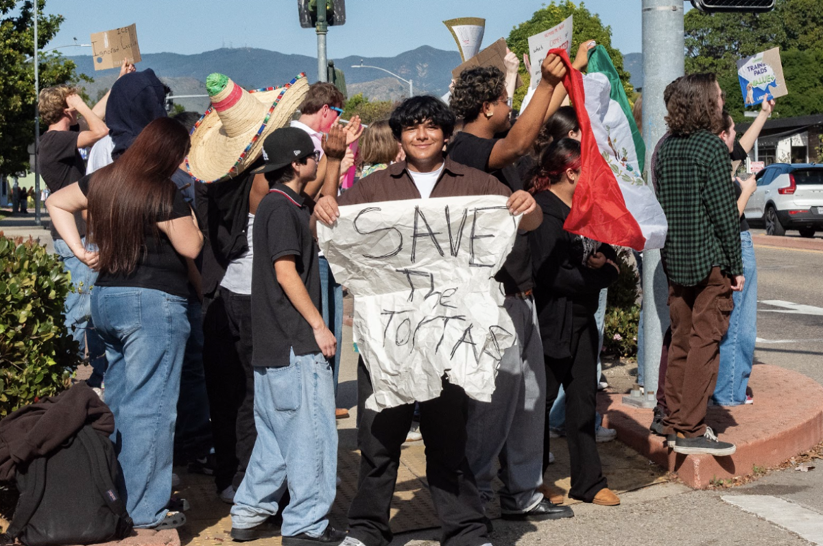 Dozens of SLO High School students congregated at the intersection of Higuera Street and Madonna Road to protest ICE with handmade signs, flags and noisemakers as part of a nationwide boycott on Jan. 30.
