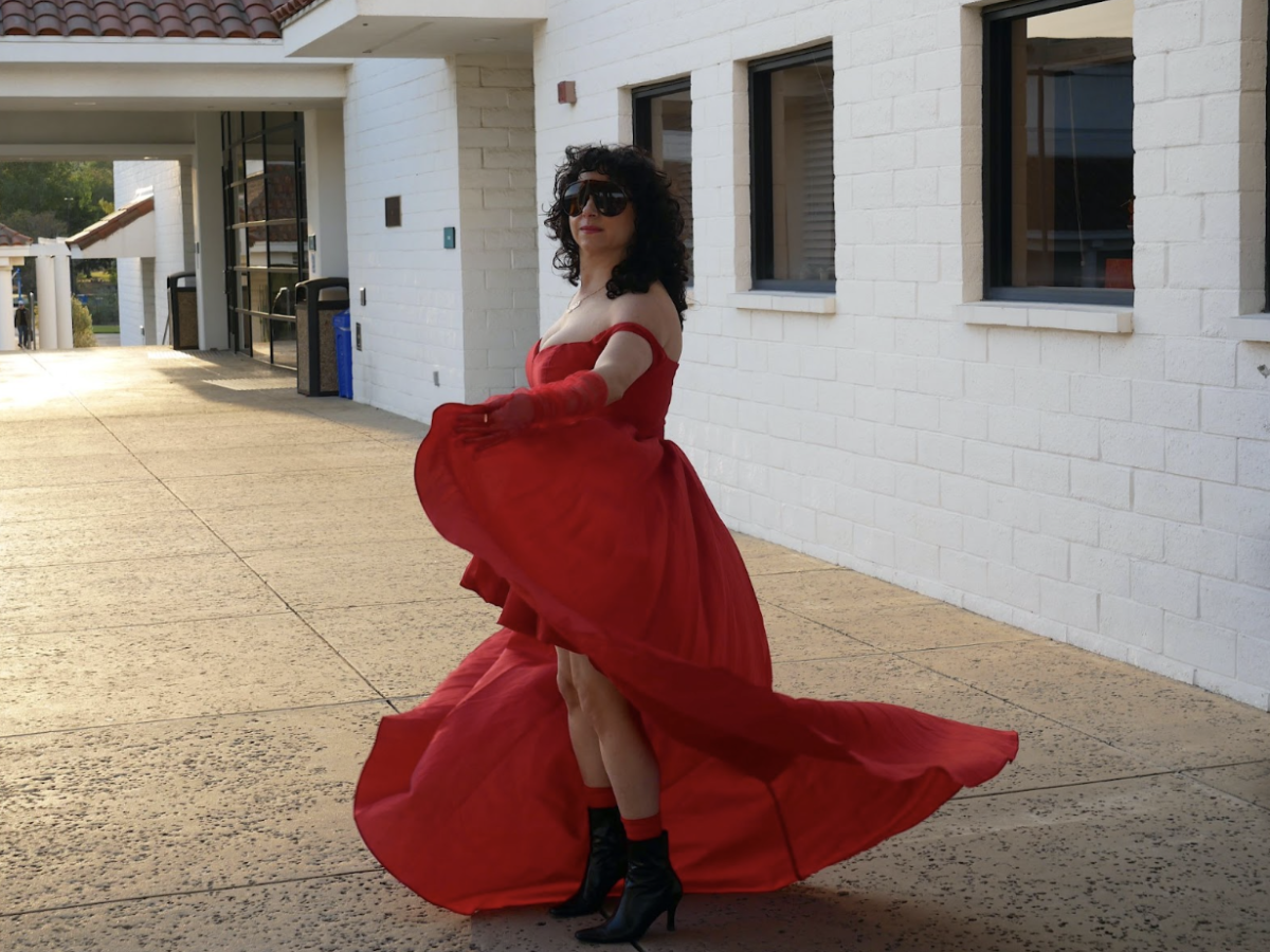 Samantha Nye swirls in her new formal wear in front of the CPAC on Cuesta College’s SLO campus before the opening of “Web of Love” on Jan. 29.