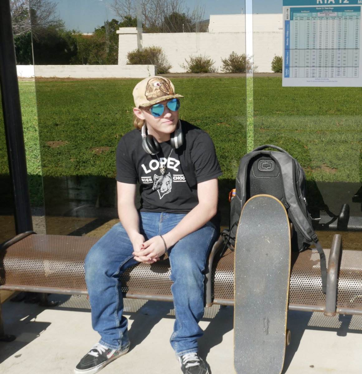 Caiden Barrios, an emergency medical technician student at Cuesta, waits for his bus at the current bus stop near the Gilbert H. Stork Gymnasium. “Most of my classes are on this side of the campus so I will have to walk quite a ways to the new bus stop near the new Student Center," he said. "I wish the bus route could include both the old and the new bus stop locations.”