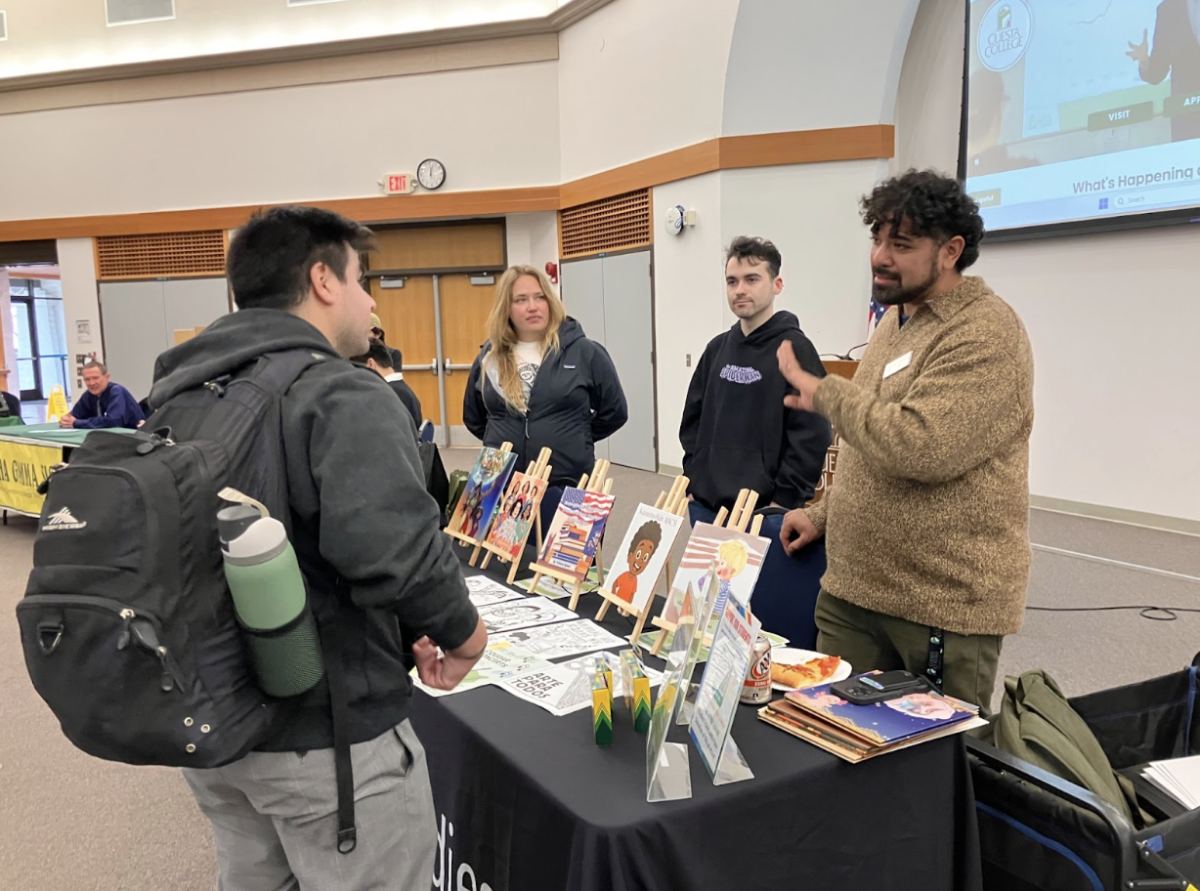 Faculty advisor for Cuesta’s Ethnic Studies Club Mario Espinoza-Kulick engages with a student at the Cuesta College Club Fair in the 5400 Building on Feb. 10. He explained the importance of having open discussions about diversity and different cultures, and highlights the club’s mission to promote ethnic events and media on campus. In honor of Black History Month, the Ethnic Studies Club also is making plans to host a movie screening open to all Cuesta students. 