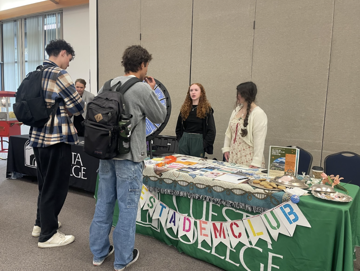 Cuesta Democratic Club Student President Mae Rosplock and Vice President Emma Rogers offer resource pamphlets to students at the Cuesta College Club Fair event on Feb. 10 in the 5100 Building. “We hope to be a space where students can come talk about and process what is happening in the world and to work as a support system, where we encourage each other to continue being engaged not only in global politics, but our own community too,” Rogers said. The club’s first event of the semester is this Thursday in the same room featuring SLO NAACP President Barry Stokes. 

