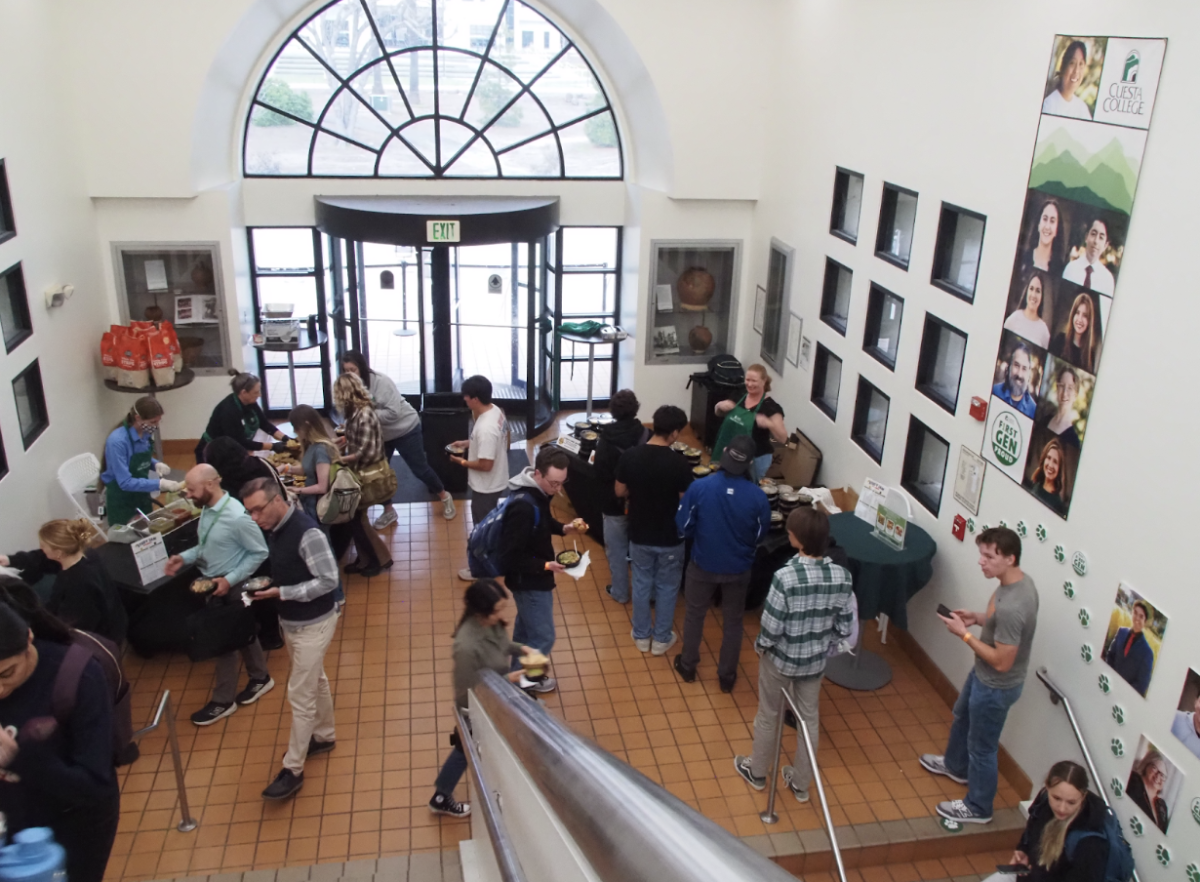 Students line up to grab free food from El Pollo Loco after signing in, then move to their study spot. “It is great that food is there at the start -helps getting charged up before diving in,” chemistry tutor Jade Iskander said.