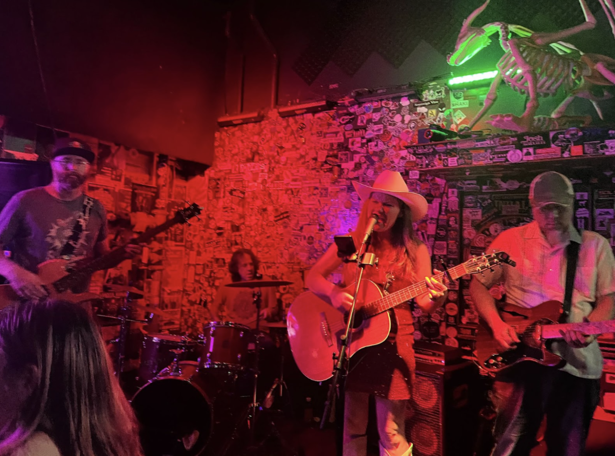 Jeremy Lemen (left to right), Luis Monge, Noach Tangeras and Toan Chau filling in on guitar, performing at Frog & Peach Pub on Higuera Street.
