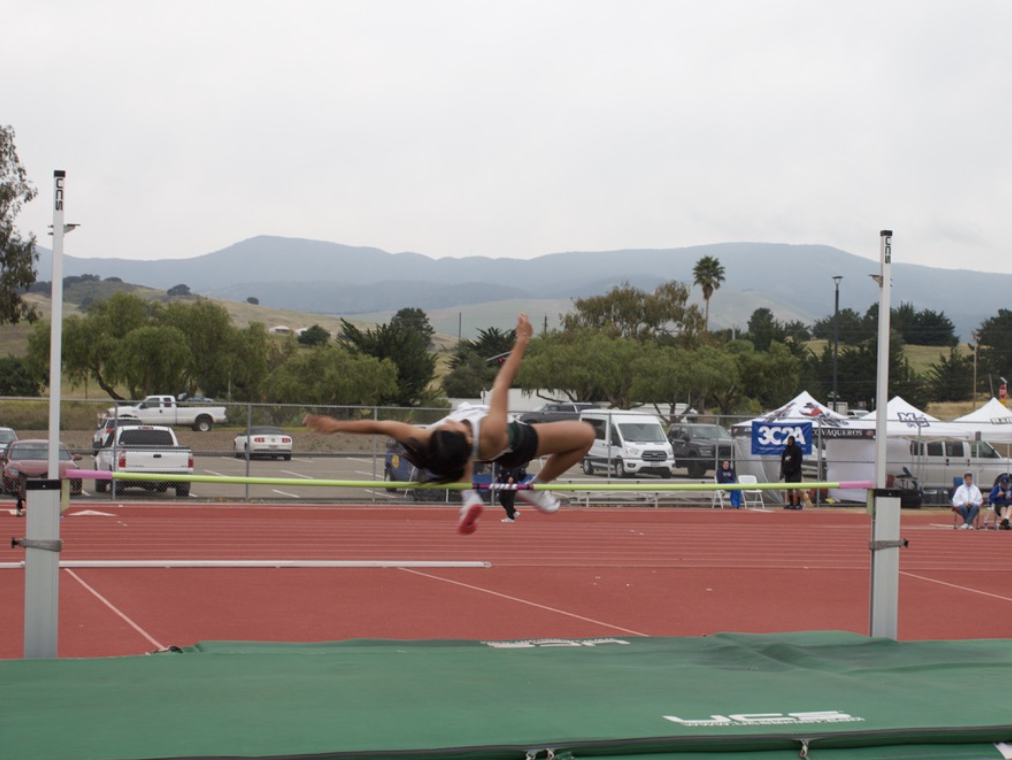Sophomore Kristy Huynh leaps over the pole vault at Cuesta College Track on March 31.
